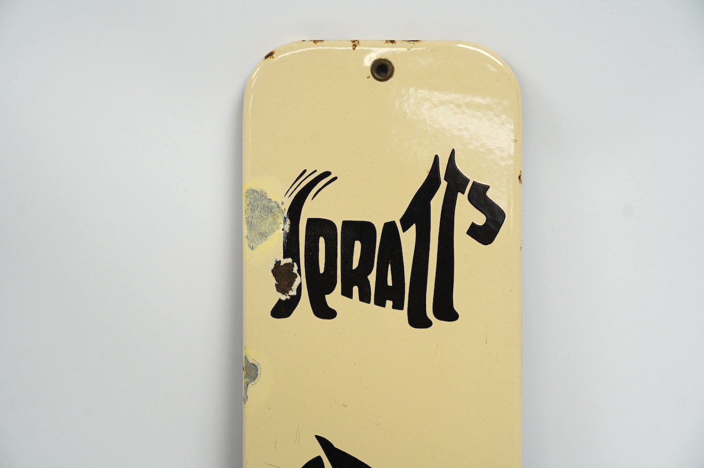 A vintage Spratt's dog, cat, budgerigar and fish enamel advertising sign, 13cm wide, 61cm high. Condition - fair